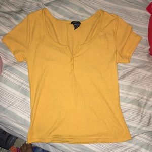 Yellow Rue 21 shirt.
